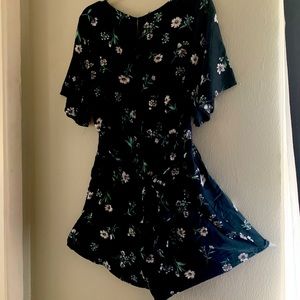 Brand Active USA, floral romper , color navy blue, size Teens Medium, used.